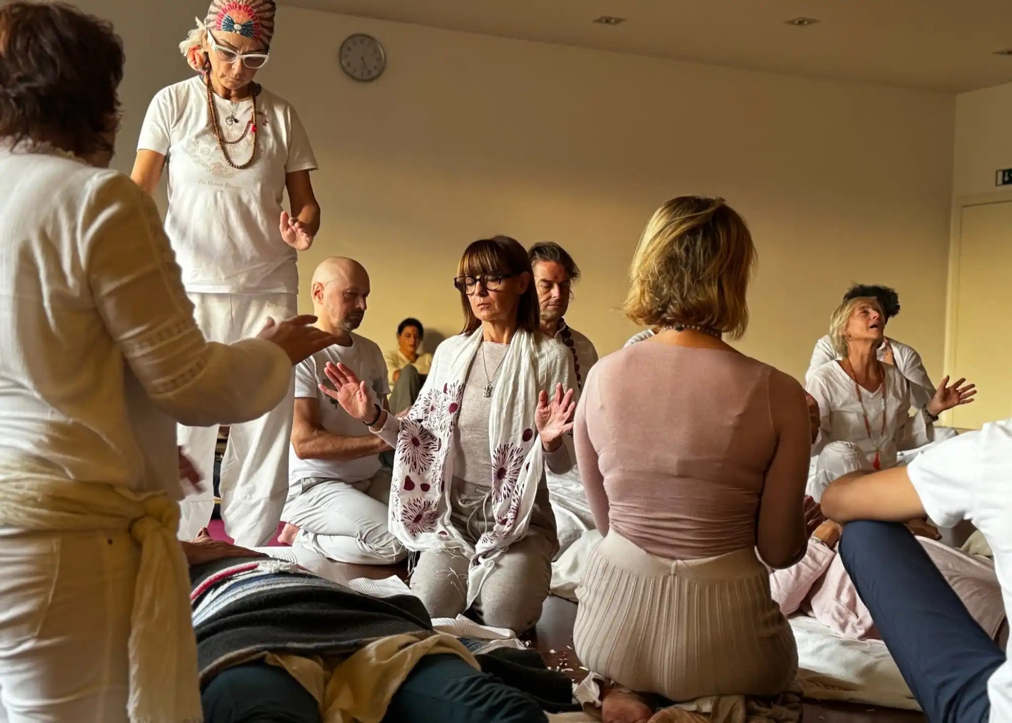 Group of people in white clothing.